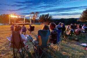 People watching an outdoor concert at Belvedere Austin